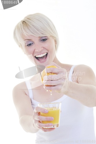 Image of Young woman squeeze orange juice