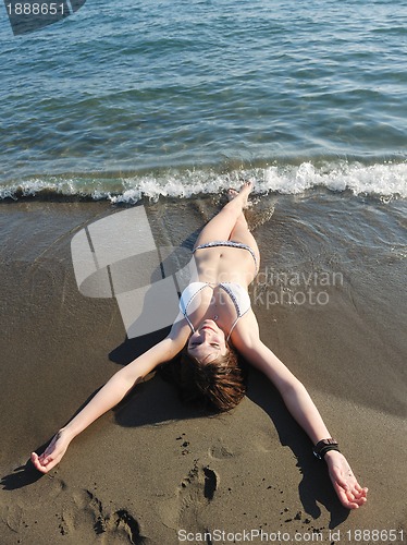 Image of young woman relax  on beach