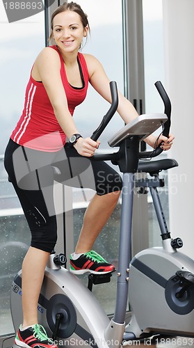 Image of woman workout  in fitness club on running track 