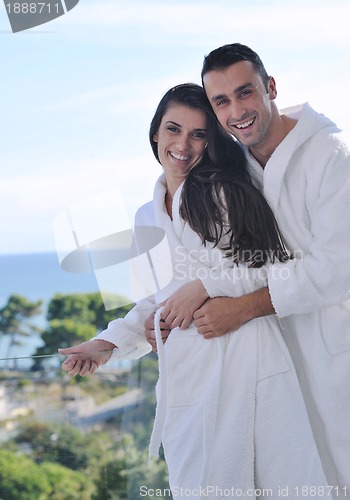 Image of couple relaxing on balcony