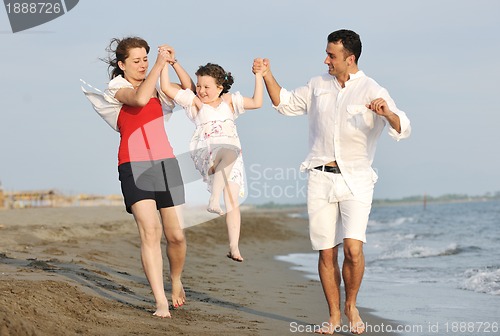 Image of happy young family have fun on beach