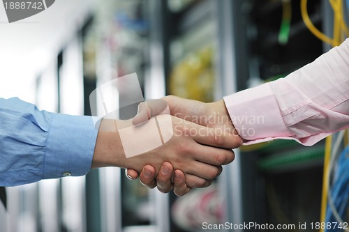 Image of it engineers in network server room