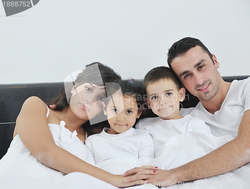 Image of happy young Family in their bedroom