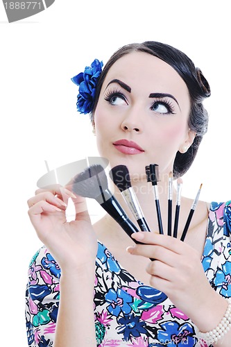 Image of beautiful young woman applying makeup