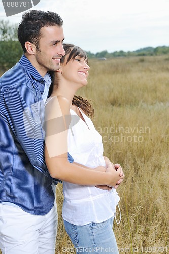 Image of happy young couple have romantic time outdoor