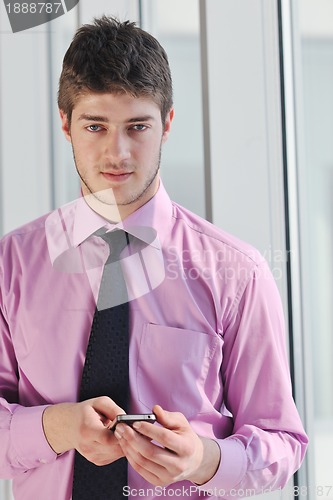 Image of young business man talk by cellphone