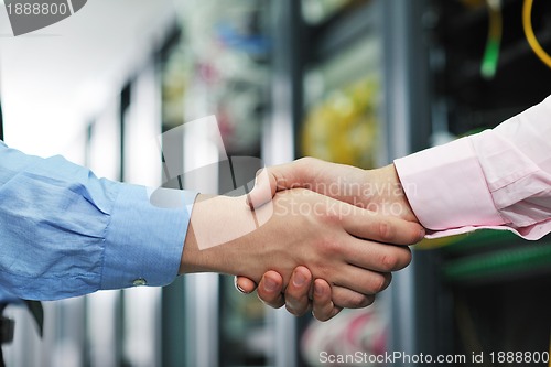 Image of it engineers in network server room