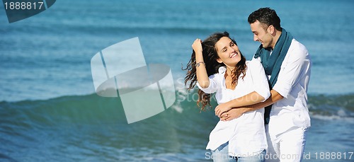 Image of happy young couple have fun at beautiful beach