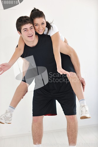 Image of happy young couple fitness workout and fun