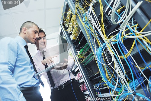 Image of it engineers in network server room