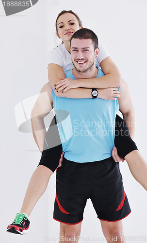 Image of happy young couple fitness workout and fun