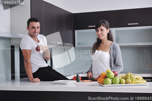 Image of young couple have fun in modern kitchen
