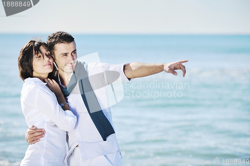 Image of happy young couple have fun at beautiful beach