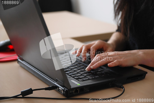 Image of young woman with laptop 