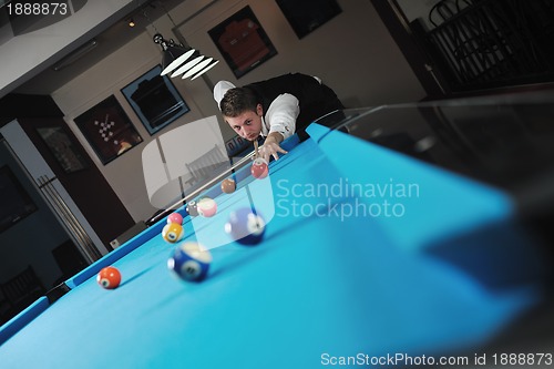 Image of young man play pro billiard game 