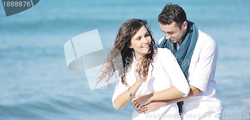 Image of happy young couple have fun at beautiful beach