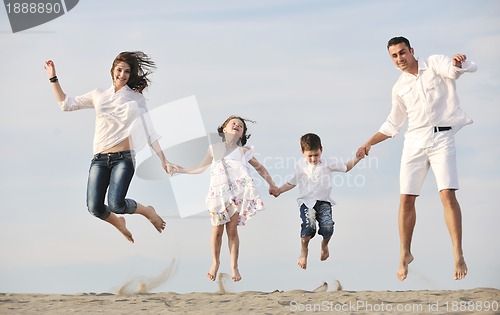 Image of happy young family have fun on beach