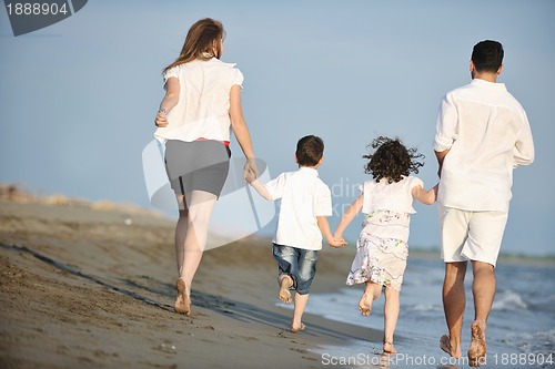 Image of happy young family have fun on beach