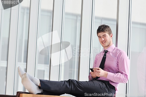 Image of young business man talk by cellphone