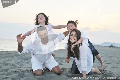 Image of happy young family have fun on beach