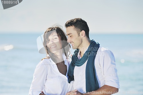 Image of happy young couple have fun at beautiful beach