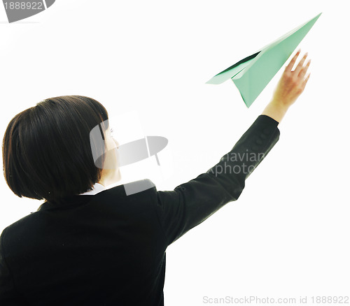 Image of business woman throwing  paper airplane 