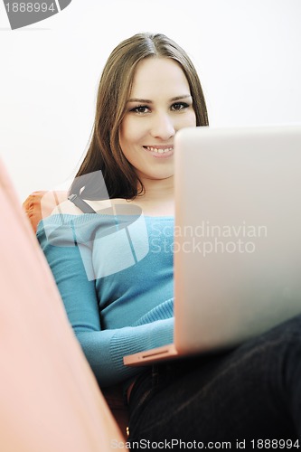 Image of one young woman working on laptop