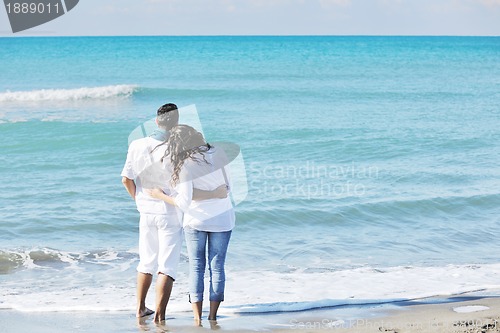 Image of happy young couple have fun at beautiful beach