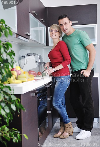 Image of young couple have fun in modern kitchen