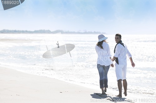 Image of happy young couple have fun at beautiful beach