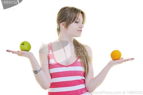 Image of happy  young  woman eat apple isolated  on white