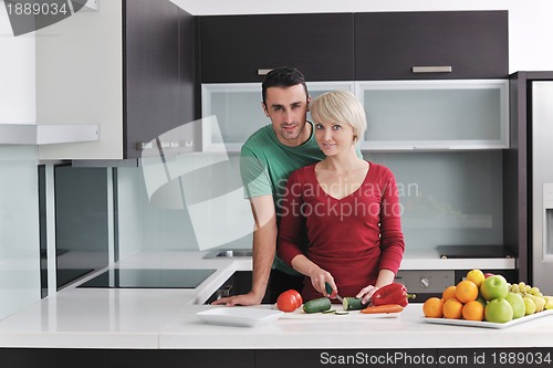 Image of young couple have fun in modern kitchen