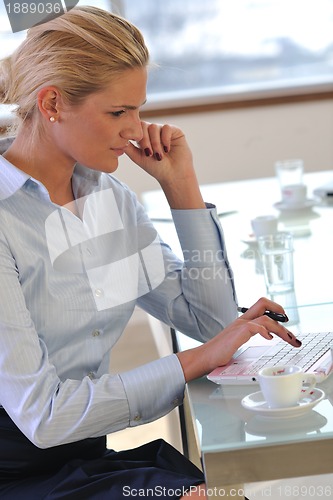 Image of young business woman on meeting