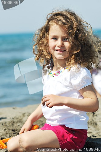 Image of little female  child portrait on the beach