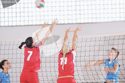 Image of girls playing volleyball indoor game
