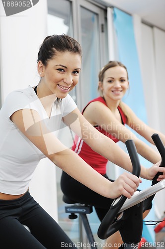 Image of woman workout  in fitness club on running track 