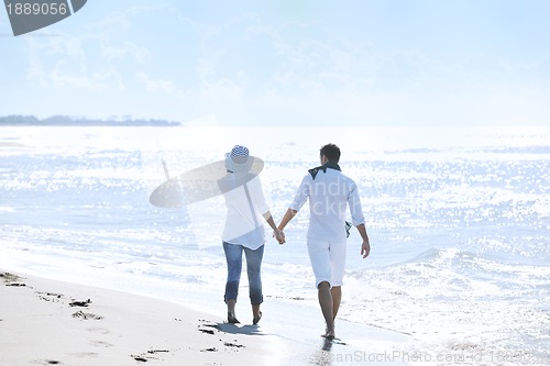 Image of happy young couple have fun at beautiful beach