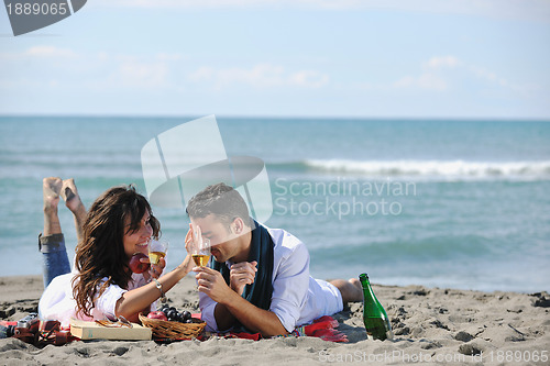 Image of happy family playing with dog on beach