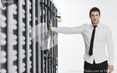 Image of young it engeneer in datacenter server room