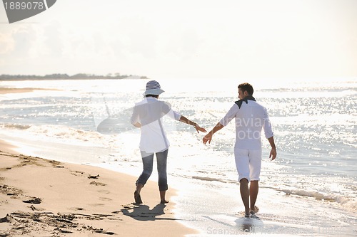 Image of happy young couple have fun at beautiful beach