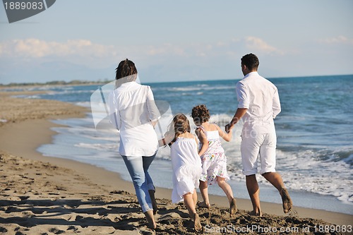 Image of happy young  family have fun on beach
