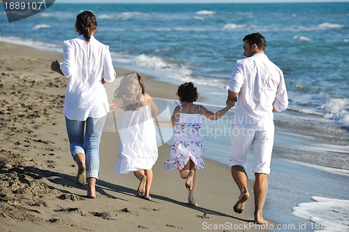 Image of happy young  family have fun on beach