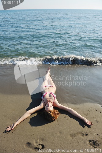 Image of young woman relax  on beach