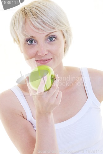 Image of happy  young  woman eat green apple isolated  on white