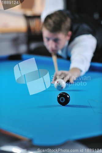 Image of young man play pro billiard game 