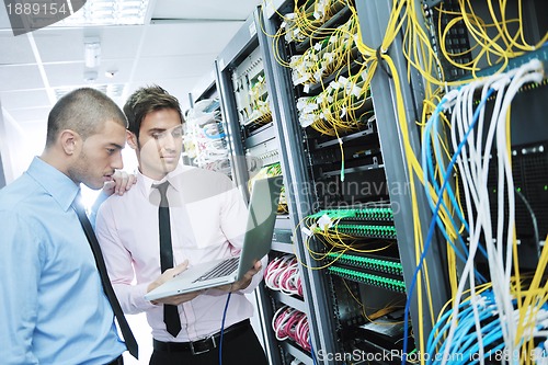 Image of it enineers in network server room