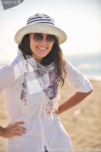 Image of happy young woman on beach
