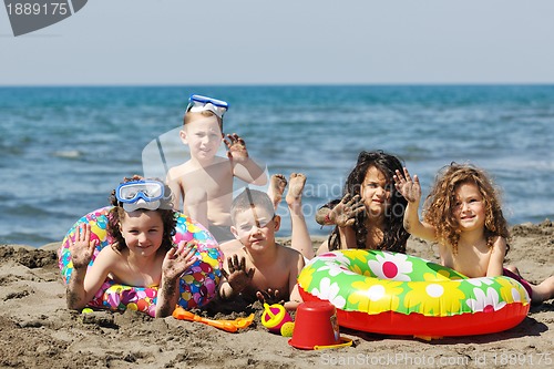Image of child group have fun and play with beach toys