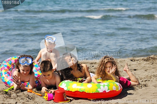 Image of child group have fun and play with beach toys