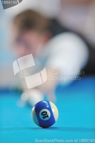 Image of young man play pro billiard game 